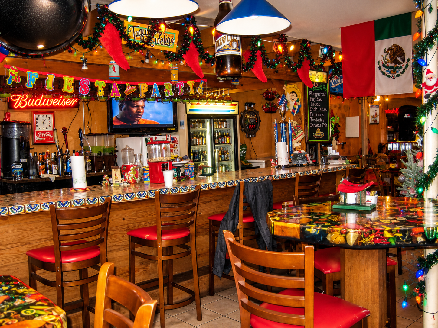 Restaurant bar with festive decorations and Mexican flag